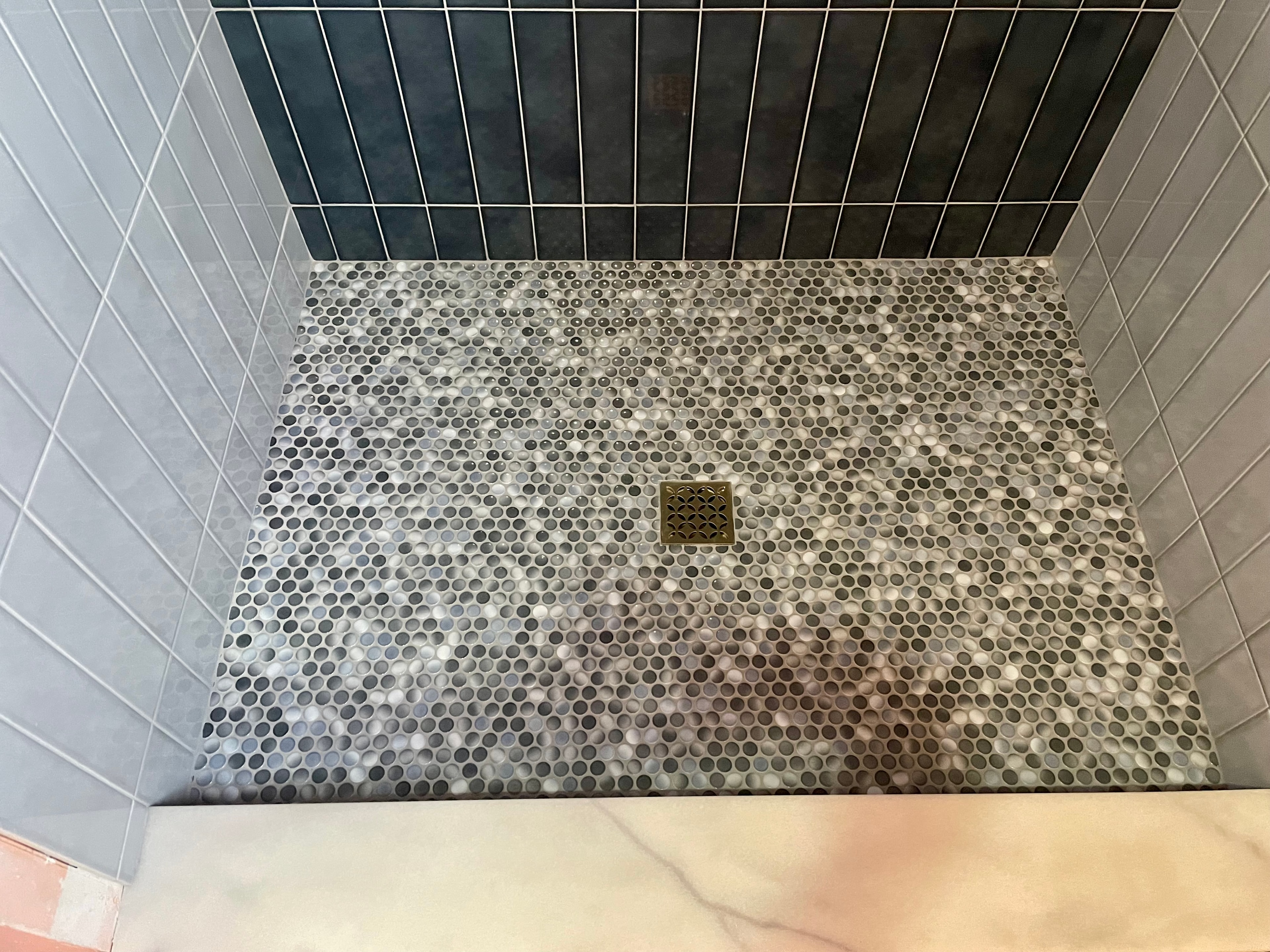 Custom shower niche with mosaic accent
